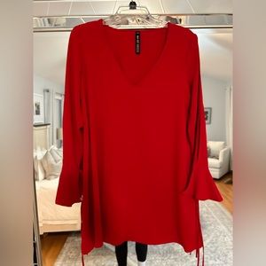 Red v-neck dress with cutout shoulders and flare/bell sleeves